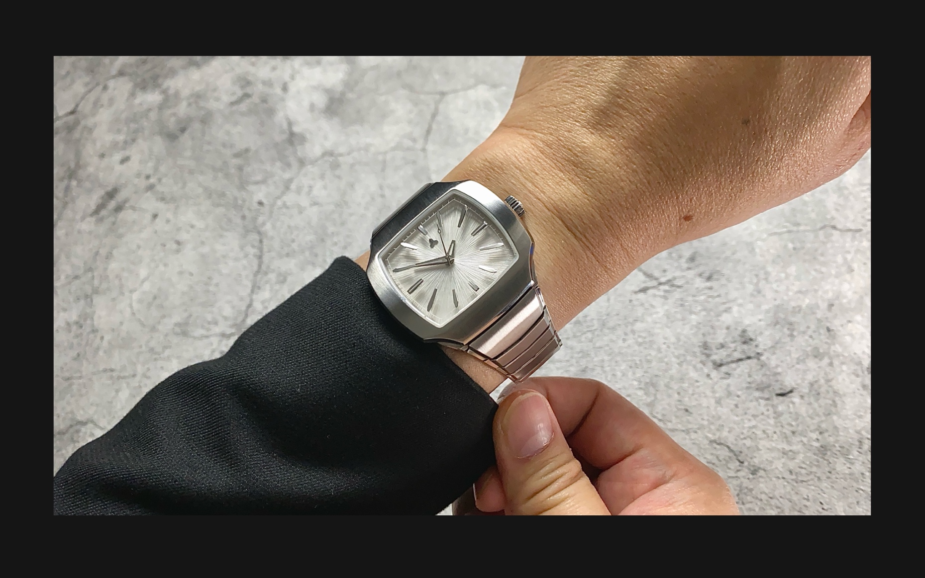 Flux Watch in Silverstone on the wrist, featuring a bold silver dial with silver hour markers and a stainless steel bracelet